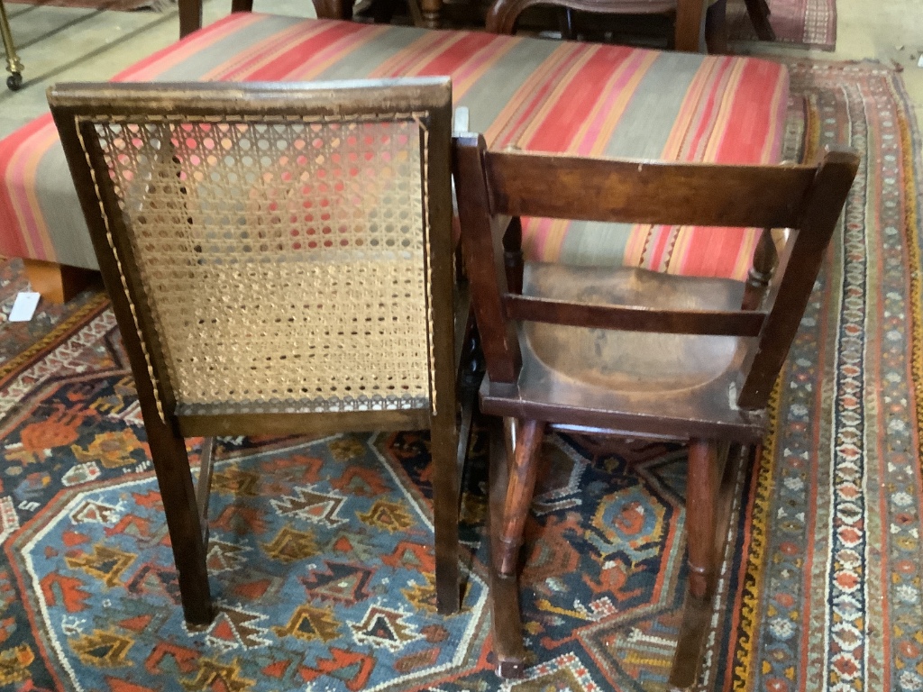 A Victorian mahogany child's rocking chair, height 60cm and a 1920's child's caned armchair, height 64cm